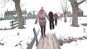Crazy brunettes in the winter going outdoors to freak out